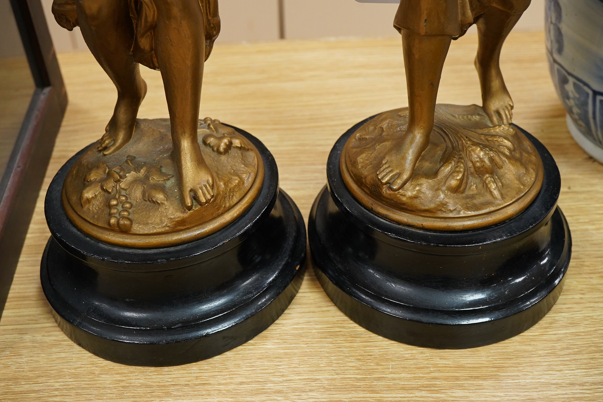 A pair of late 19th century gold-painted spelter figures, 48cm